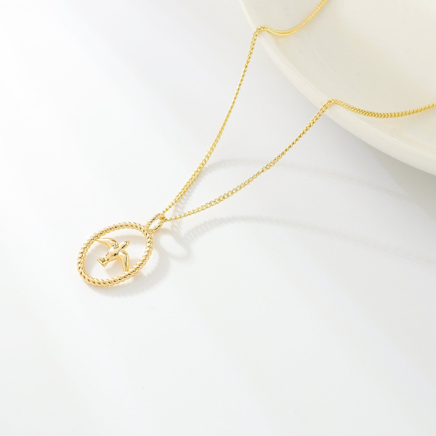 gold necklace with swallow bird