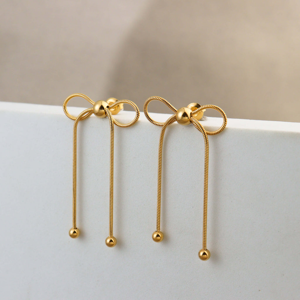 Dancing Bow Gold Earrings