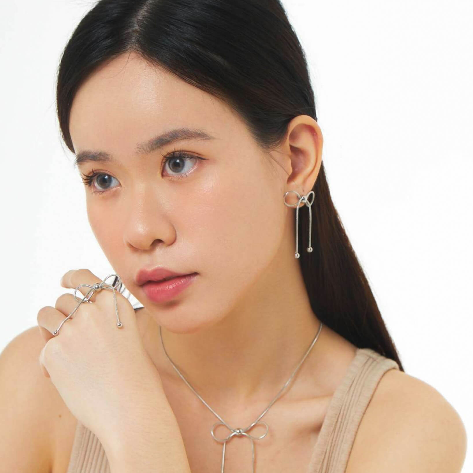 Dancing Bow Silver Earrings