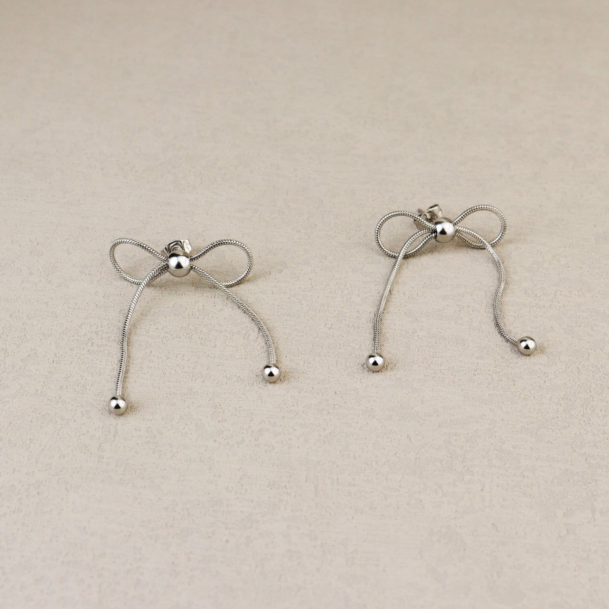 Dancing Bow Silver Earrings