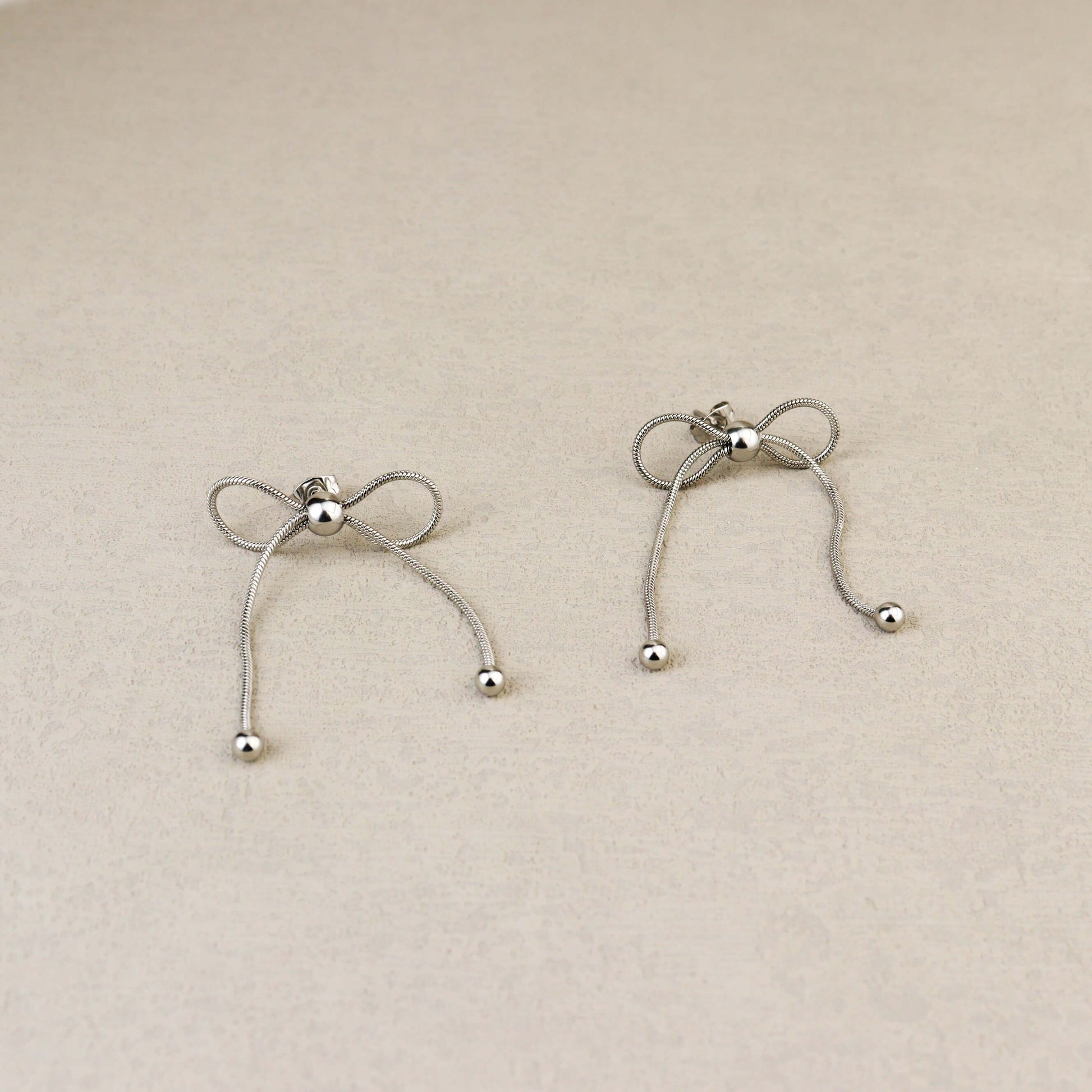 Dancing Bow Silver Earrings