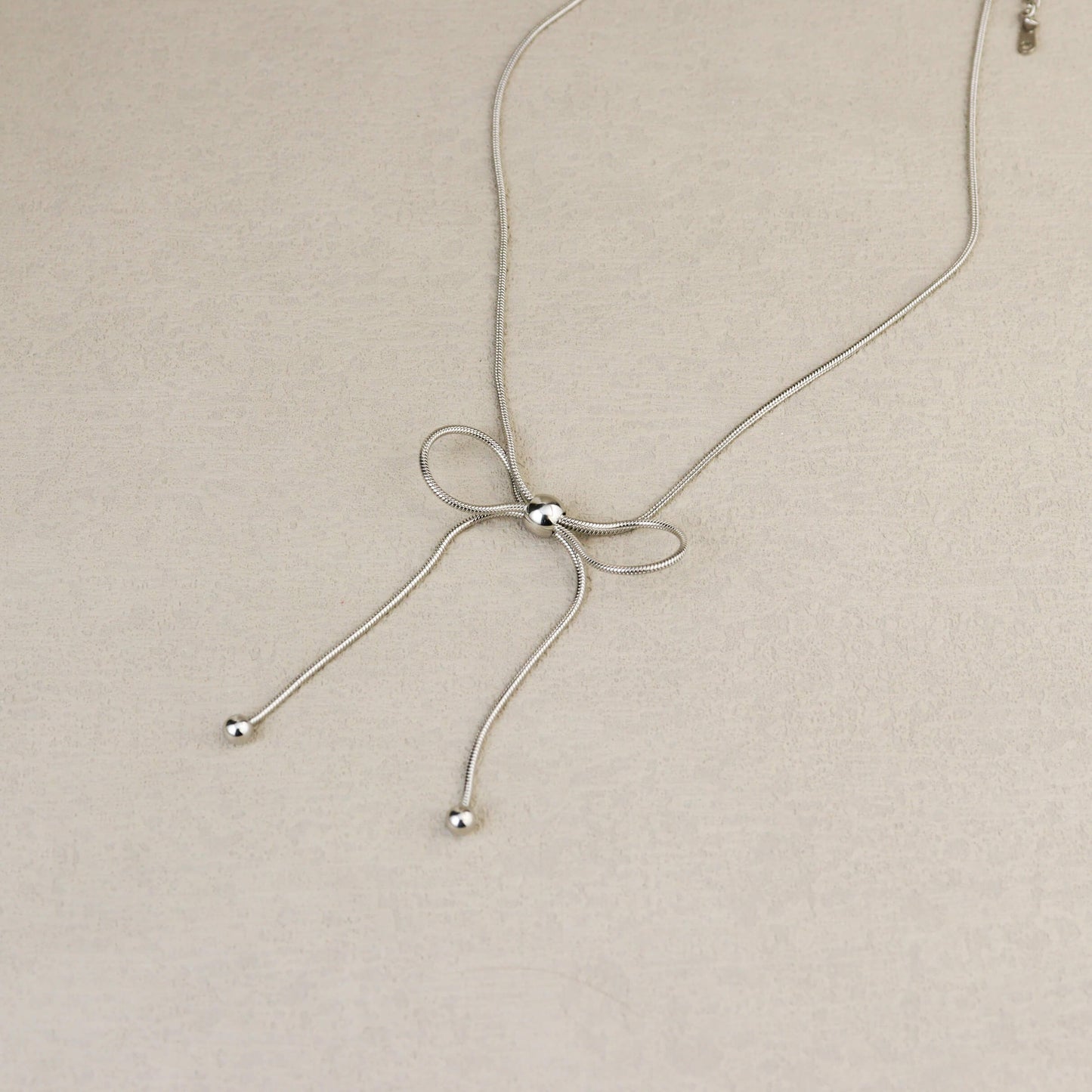 Dancing Bow Silver Necklace