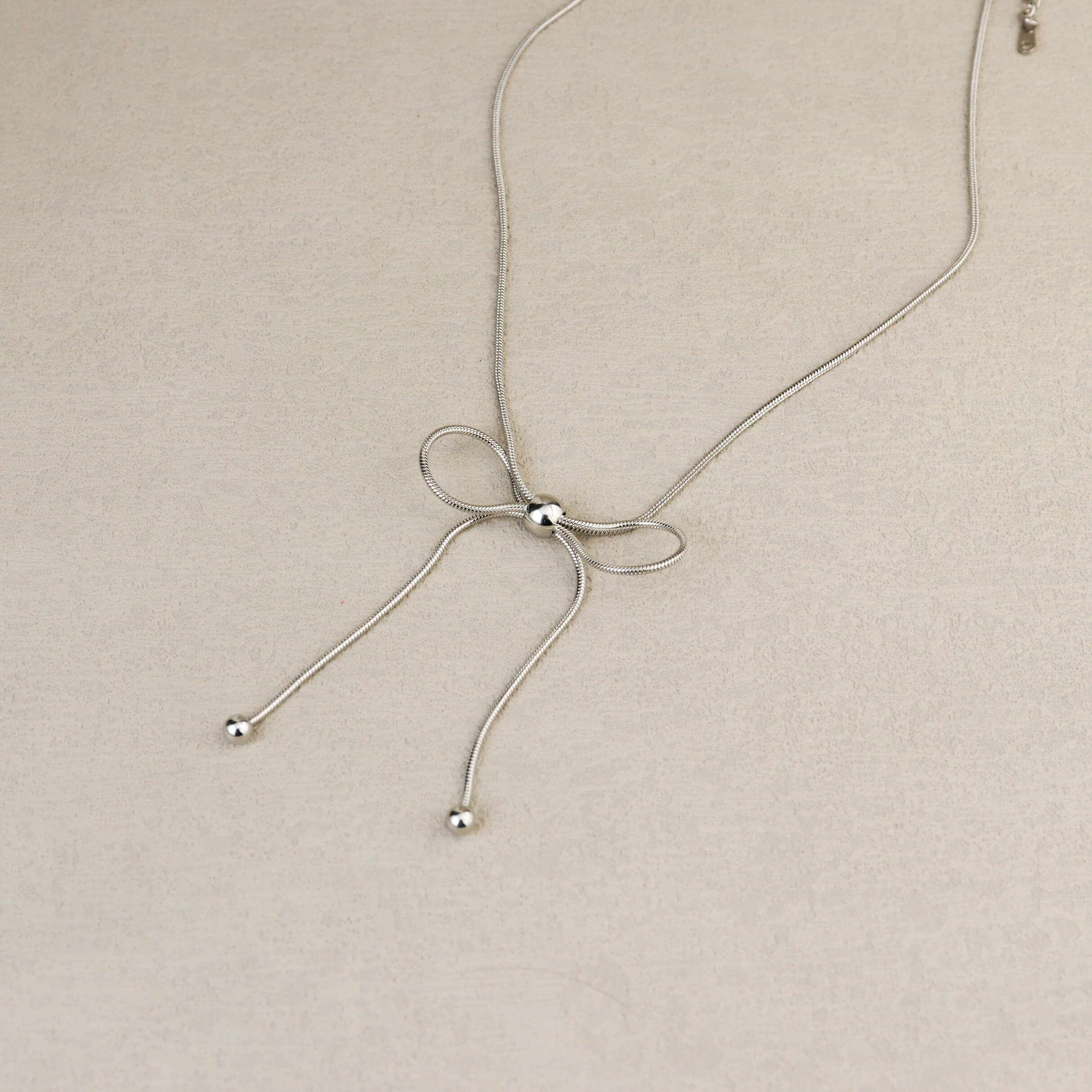 Dancing Bow Silver Necklace