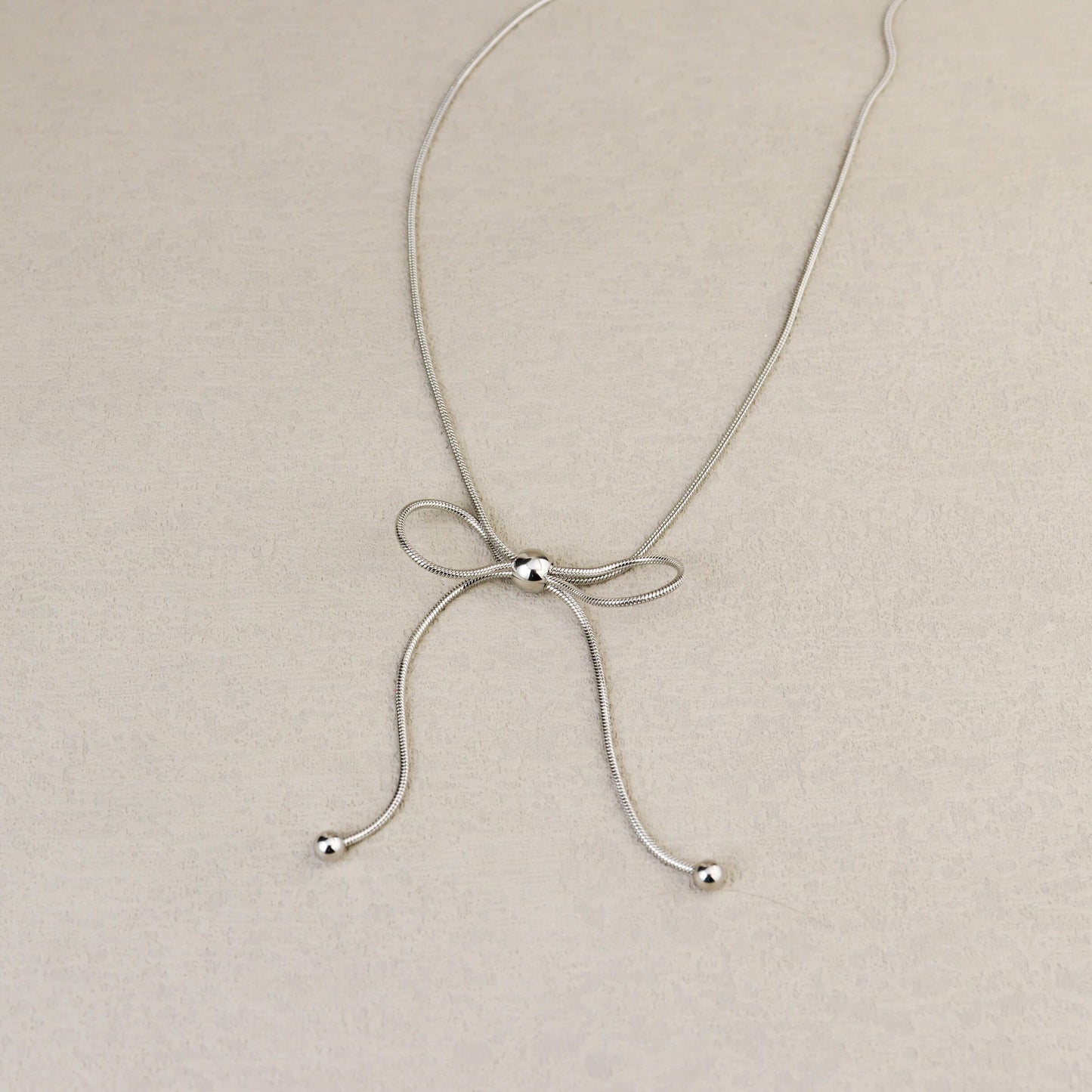 Dancing Bow Silver Necklace