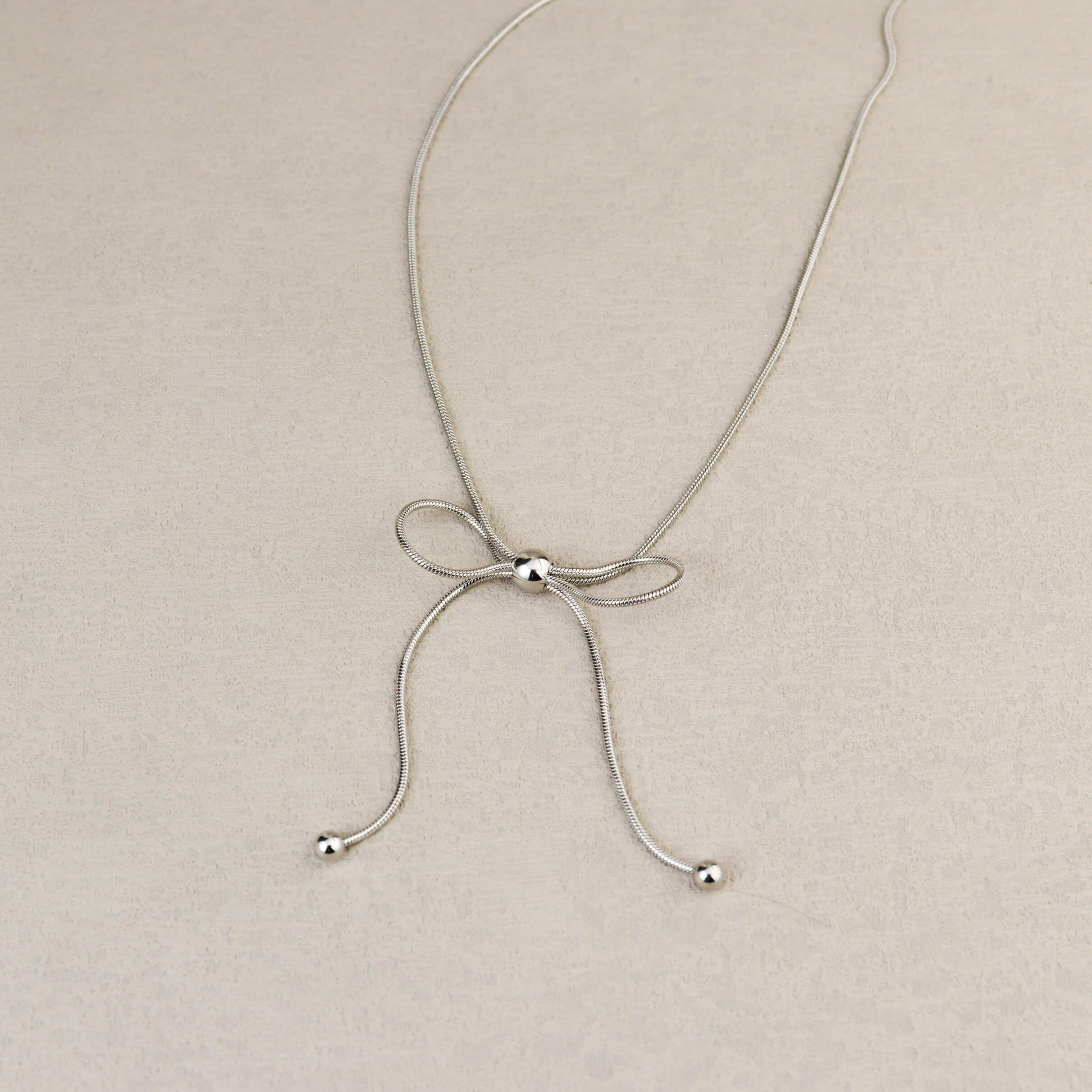 Dancing Bow Silver Necklace
