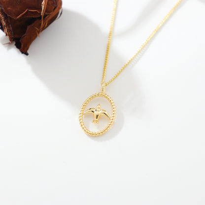 gold necklace with swallow bird