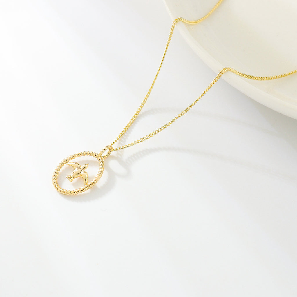 gold necklace with swallow bird