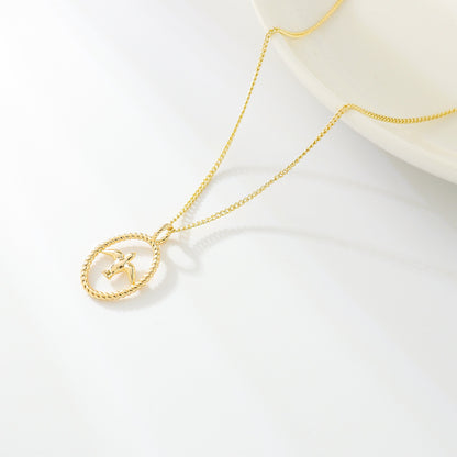 gold necklace with swallow bird